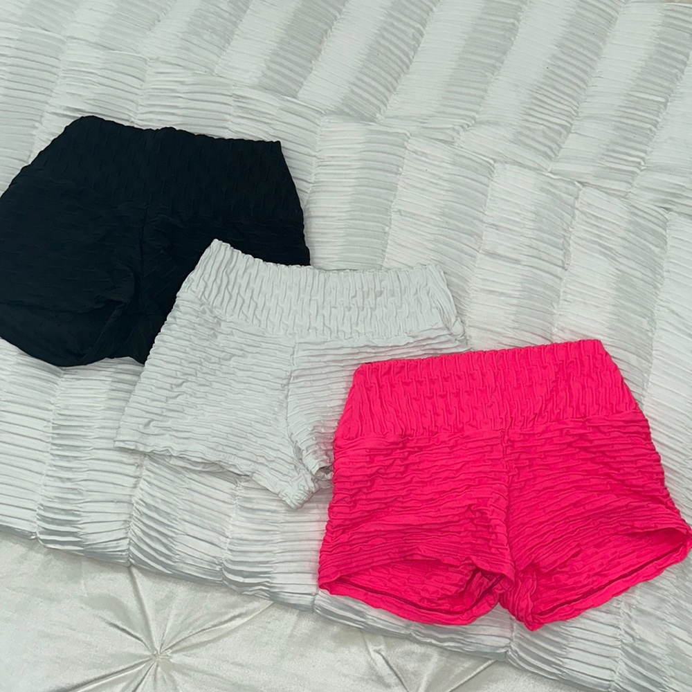 Three “one size” gym shorts